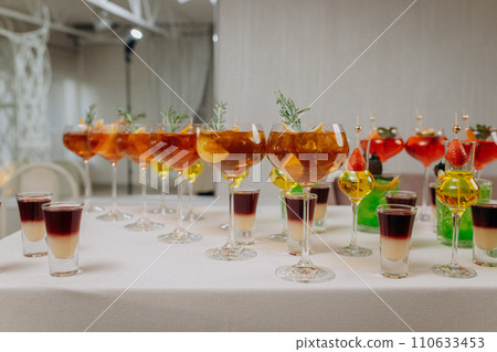 Welcome drink with cocktail glasses and drinks at an event. Alcoholic beverages at a wedding 110633453
