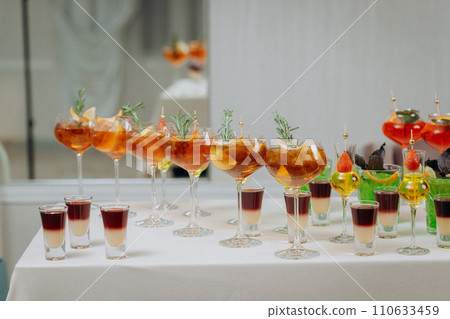 Welcome drink with cocktail glasses and drinks at an event. Alcoholic beverages at a wedding 110633459