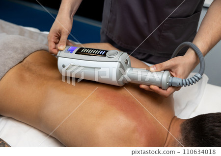 Male therapist working with a patient in a rehabilitation clinic Male therapist working with a patient in a rehabilitation clinic 110634018