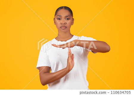 Serious Young Black Woman Showing Time Out Hand Gesture, Studio 110634705