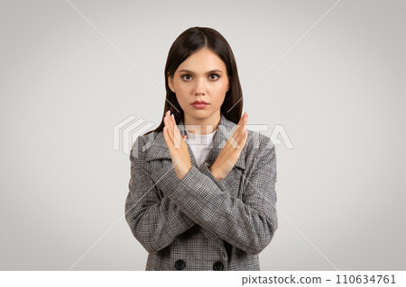 Serious woman making no gesture with arms crossed in front 110634761