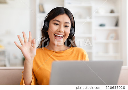 Closeup asian lady have online meeting with family, home interior 110635028