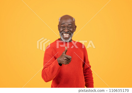 Smiling senior man with a vibrant personality gives a thumbs-up sign 110635170