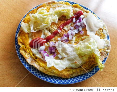 Indian Spiced Masala Omelet filled with fresh vegetable, healthy meal Indian Spiced Masala Omelet filled with fresh vegetable, healthy meal 110635673