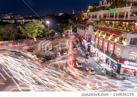 Night intersection at Dong King Ngia Tuc Square near the famous Hoan Kiem Lake in Hanoi, Vietnam Comparative light composition 110636154