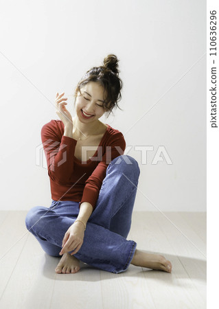 Portrait of a young woman in red clothes, vertical position Portrait of a young woman in red clothes, vertical position 110636296