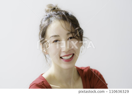 Portrait of a young woman in red clothes 110636329