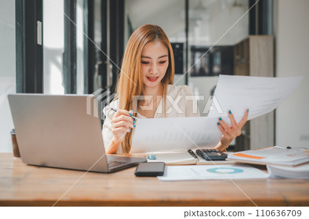 Business woman manager accounting analyst checking bills, analyzing sales statistics management, taxes financial data documents or marketing report papers working in office Business woman manager accounting analyst checking bills, analyzing sales statistics management, taxes financial data documents or marketing report papers working in office 110636709