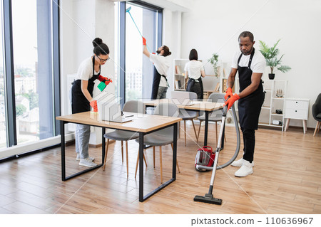 Team of young multicultural cleaners . 110636967