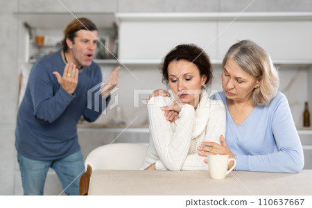 Man proves to woman that he is right, she is upset and her mother comforts her Man proves to woman that he is right, she is upset and her mother comforts her 110637667