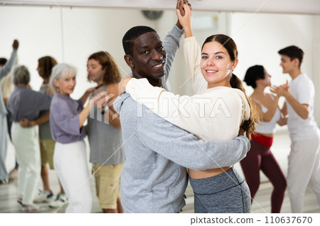 Young girl and adult man dancing slow ballroom dances in pair 110637670