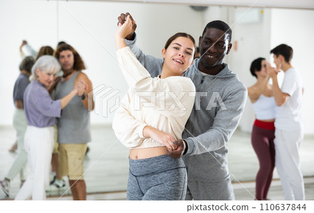 Dancing positive couples learning salsa 110637844