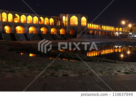 Night view of Harj Bridge in Isfahan reflected in the river Night view of Harj Bridge in Isfahan reflected in the river 110637849