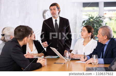 Businessman holding meeting for senior managers in meeting room 110637922