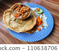 Healthy Chole Bhature tasty Indian dish made using wheat flour is arranged in a porcelain plate 110638706