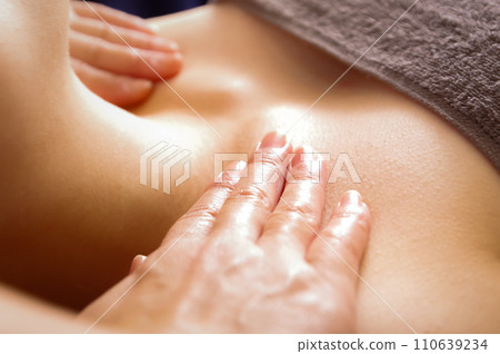 A woman receiving a chest massage A woman receiving a chest massage 110639234