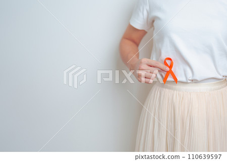 Woman having back abdomen pain with Orange ribbon. Kidney Cancer Awareness March month, disease of Urinary system and Stones, Cancer, Chronic kidney, Urology, Renal and Transplant concept 110639597
