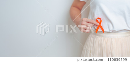 Woman having back abdomen pain with Orange ribbon. Kidney Cancer Awareness March month, disease of Urinary system and Stones, Cancer, Chronic kidney, Urology, Renal and Transplant concept 110639599