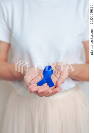 March Colorectal Cancer Awareness month, doctor with dark Blue Ribbon for supporting people living and illness. Healthcare, hope and World cancer day concept March Colorectal Cancer Awareness month, doctor with dark Blue Ribbon for supporting people living and illness. Healthcare, hope and World cancer day concept 110639633