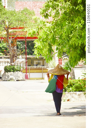People visiting temples in Thailand wearing bamboo hats People visiting temples in Thailand wearing bamboo hats 110640031