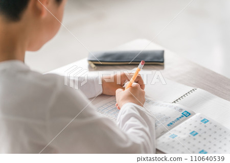 Elementary school boy dictating kanji for homework (drill/preparation/review/study) Elementary school boy dictating kanji for homework (drill/preparation/review/study) 110640539