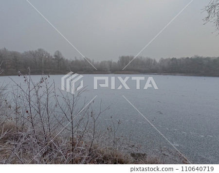 Winter's Hush: Frost Over the Lake 110640719