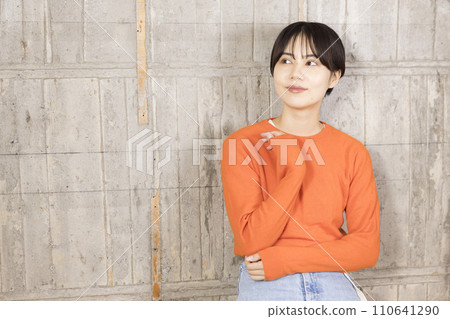 A woman sitting in a chair and smiling 110641290