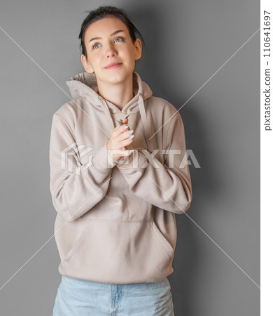 Portrait of a young pretty girl in a  hoodie 110641697