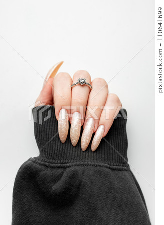 Manicured nails with pearlescent nail polish Manicured nails with pearlescent nail polish 110641699