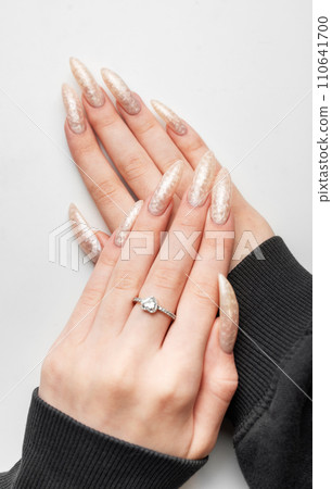 Manicured nails with pearlescent nail polish Manicured nails with pearlescent nail polish 110641700