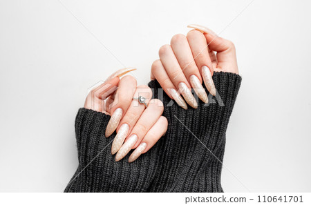 Manicured nails with pearlescent nail polish Manicured nails with pearlescent nail polish 110641701
