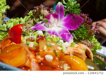 Vibrant Salad with Orchid Embellishment 110641732