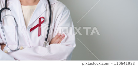 Doctor with Burgundy Red Ribbon for March multiple myeloma Cancer and December World Aids Day Awareness month. Healthcare and world cancer day concept Doctor with Burgundy Red Ribbon for March multiple myeloma Cancer and December World Aids Day Awareness month. Healthcare and world cancer day concept 110641958