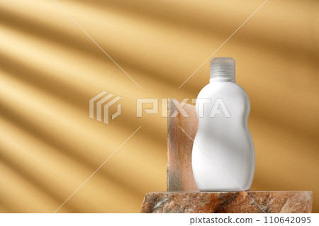 Cosmetic package dispenser with granite stone studio shot Cosmetic package dispenser with granite stone studio shot 110642095