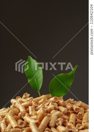 Wood pellets biofuel pile on gray background Wood pellets biofuel pile on gray background 110642104
