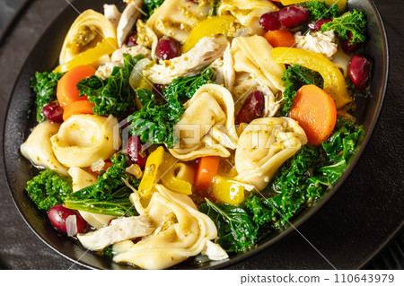 chicken minestrone soup with tortelloni in bowl chicken minestrone soup with tortelloni in bowl 110643979