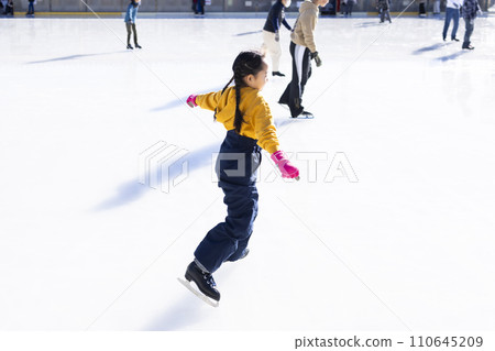 Girls enjoying ice skating 110645209