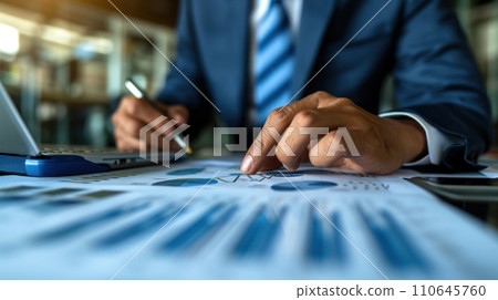 Elegantly dressed executive analyzing charts, showcasing expertise and precision in financial decision-making Elegantly dressed executive analyzing charts, showcasing expertise and precision in financial decision-making 110645760