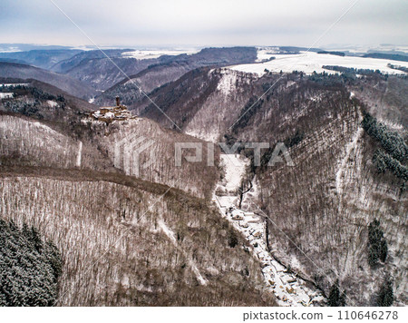 aerial view rock with medieval castle Ehrenburg near moselle river Brodenbach white winter snow wonderland forest hills 110646278