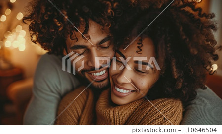 Couple celebrating milestones, their affection evident in warm, tight embraces 110646504