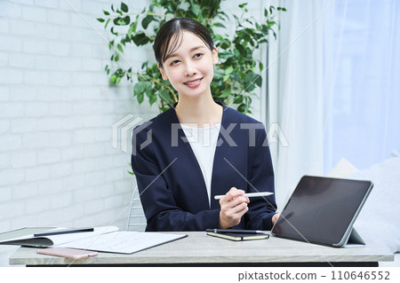 A woman in a suit wearing a smiling face A woman in a suit wearing a smiling face 110646552