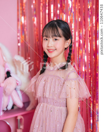 Portrait of a girl taken in a pink room 110647438