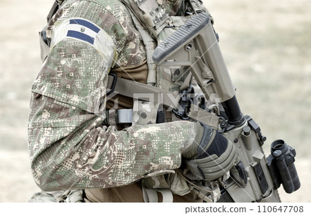 Soldier with assault rifle and flag of El Salvador on military uniform. Collage. Soldier with assault rifle and flag of El Salvador on military uniform. Collage. 110647708