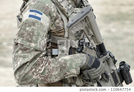 Soldier with assault rifle and flag of Nicaragua on military uniform. Collage. 110647754