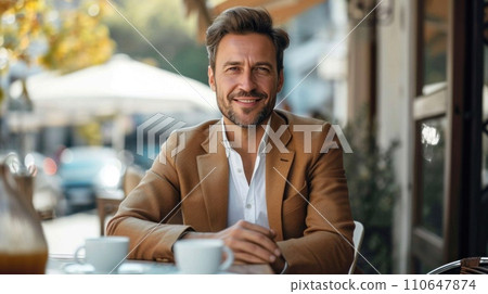 Elegant man discussing ideas over coffee, merging style with outdoor collaboration 110647874
