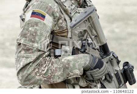 Soldier with assault rifle and flag of Venezuela on military uniform. Collage. 110648122