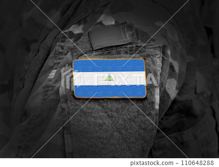 Flag of Nicaragua on military uniform. Army, troops, soldier (collage). 110648288