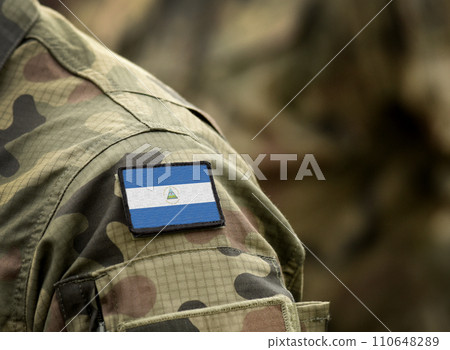 Flag of Nicaragua on military uniform. Army, troops, soldier (collage). Flag of Nicaragua on military uniform. Army, troops, soldier (collage). 110648289