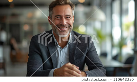 Suited businessman confidently presents strategic plans during a corporate meeting, exuding professionalism 110648350