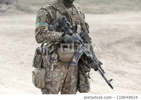 Soldier with assault rifle and flag of Rwanda on military uniform. Collage. Soldier with assault rifle and flag of Rwanda on military uniform. Collage. 110648624